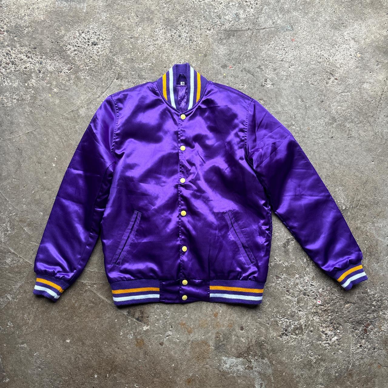 Purple bomber jacket with ‘Wonky Races’ embroidered design at the back