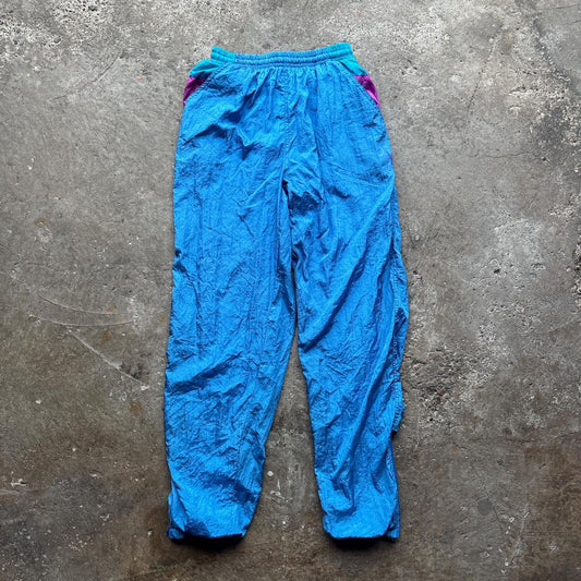 Blue vintage 80s parachute pants with elastic waist and pockets