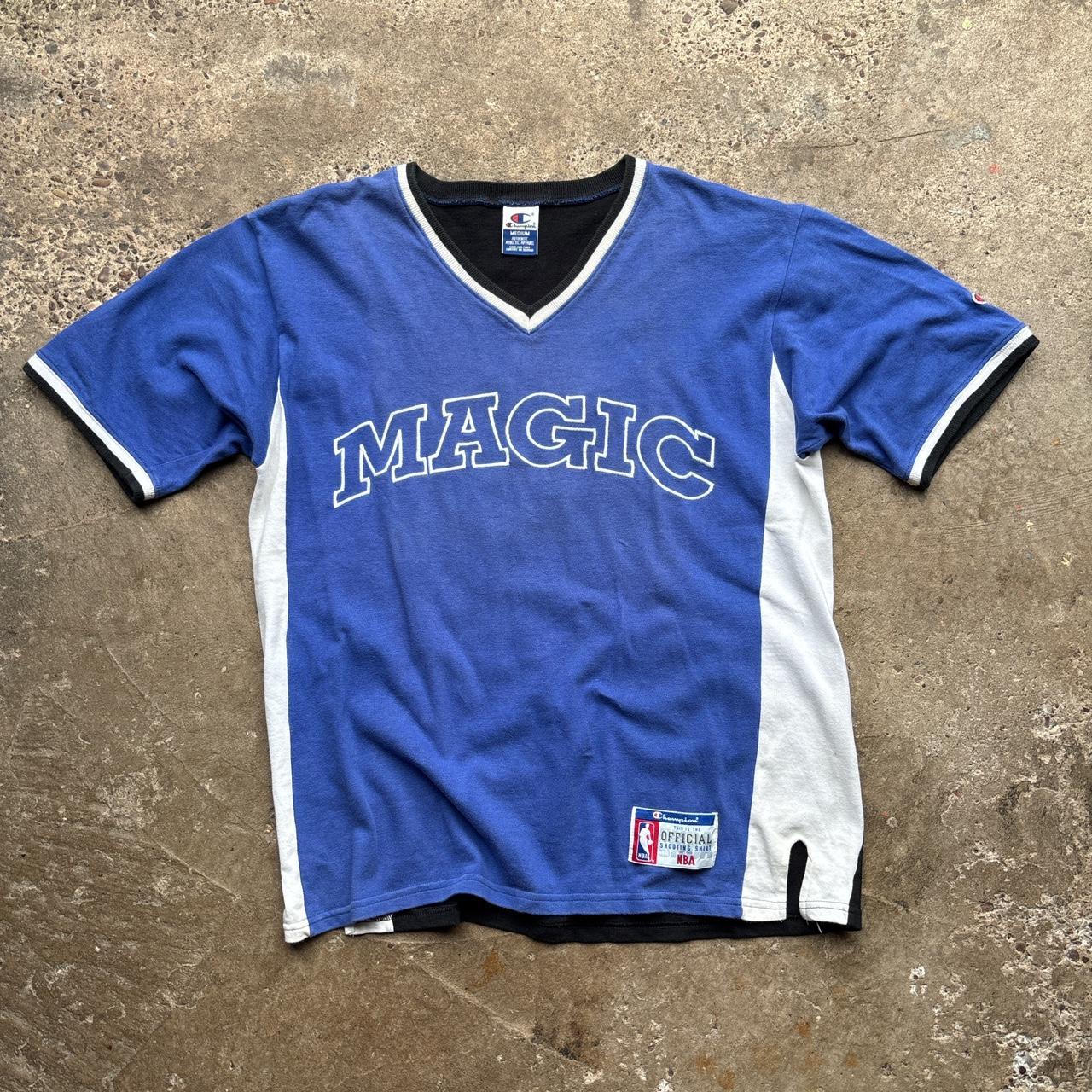 Vintage Orlando Magic 1995-97 Champion Shooting Shirt Jersey in blue, white and