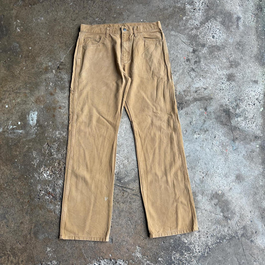 Tan Dickies straight leg carpenters pants with a relaxed fit