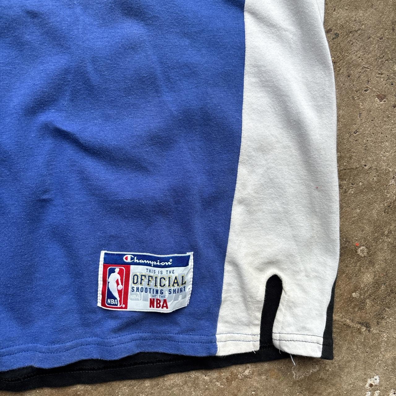 Vintage Orlando Magic 1995-97 Champion Shooting Shirt Jersey in blue, white and