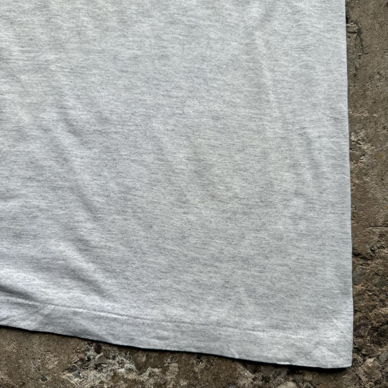 Grey graphic tee with “sorma” prints