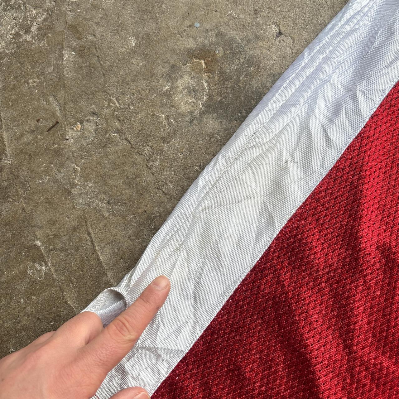 Red, blue and white Reebok CFL Alouettes jersey