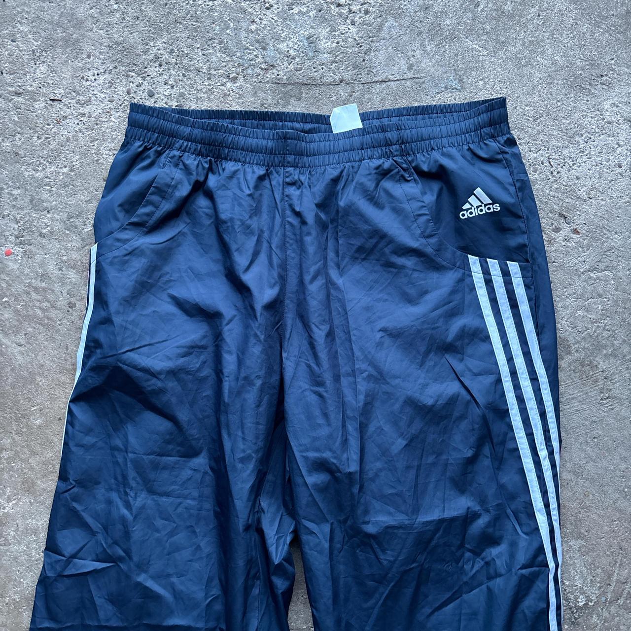 Navy blue Adidas track pants