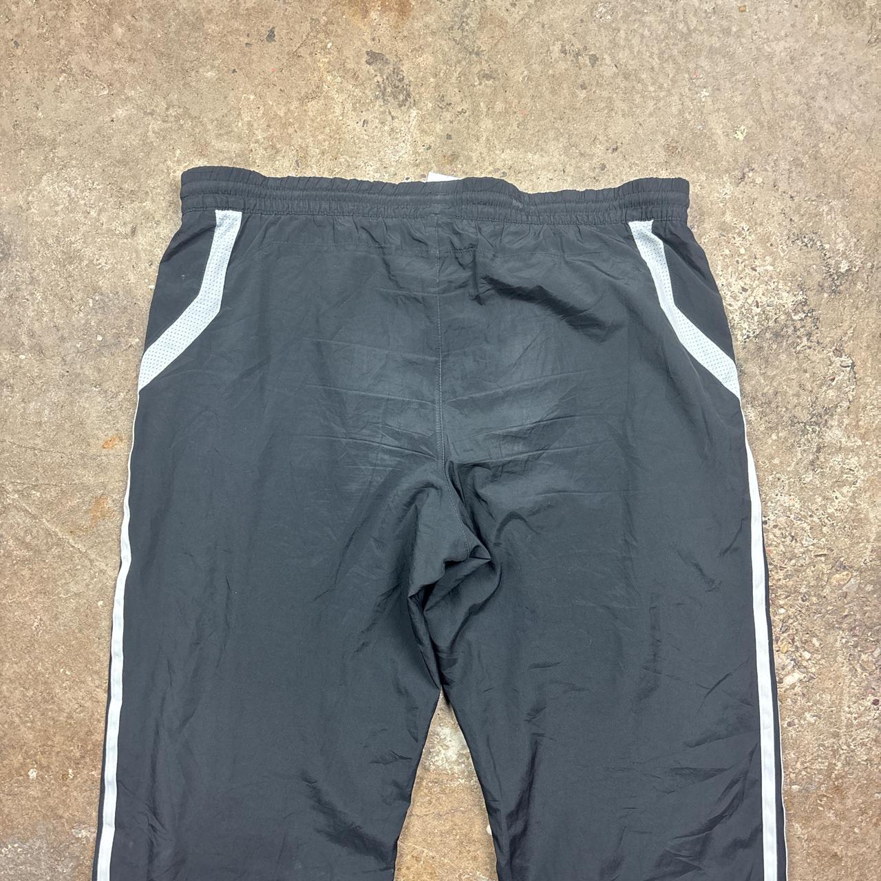 Black Adidas track pants