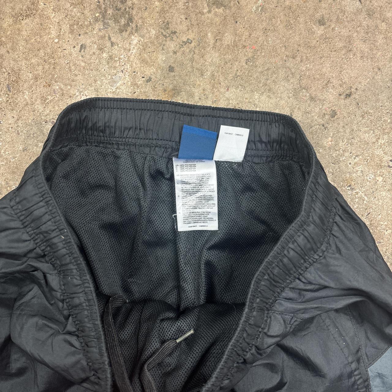 Black and grey Reebok track pants