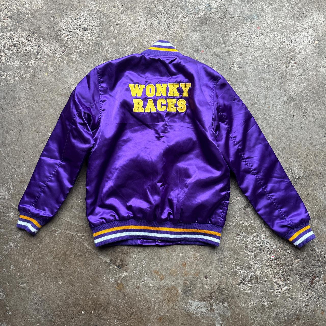 Purple bomber jacket with ‘Wonky Races’ embroidered design at the back