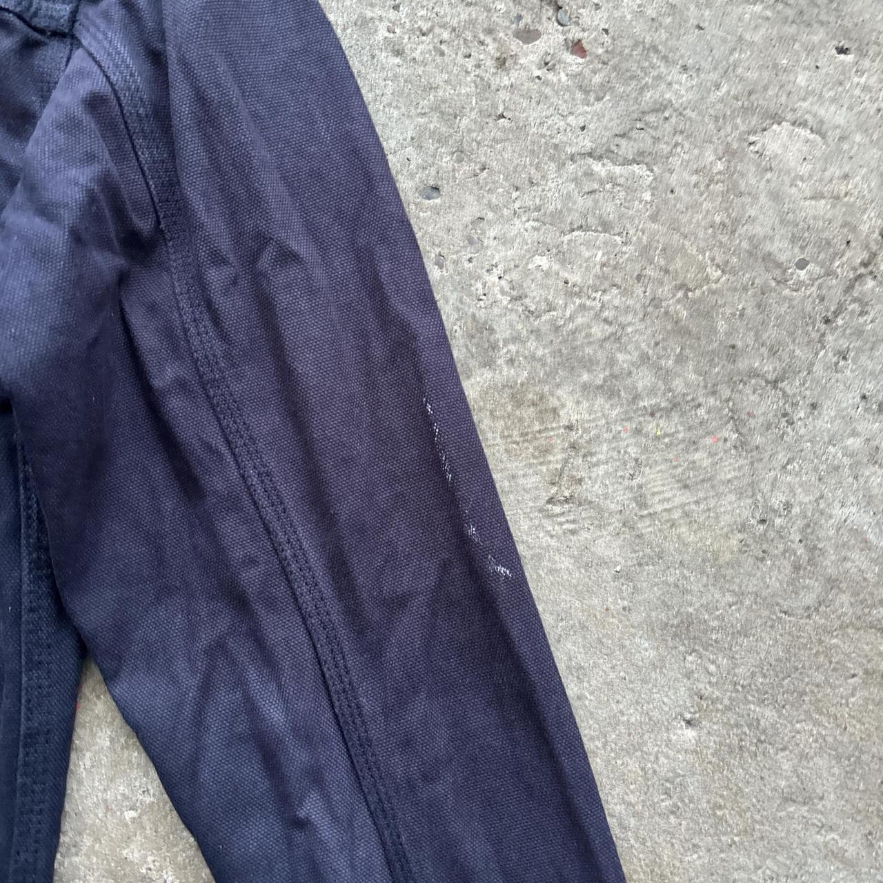 Navy workwear jacket with burgundy collar