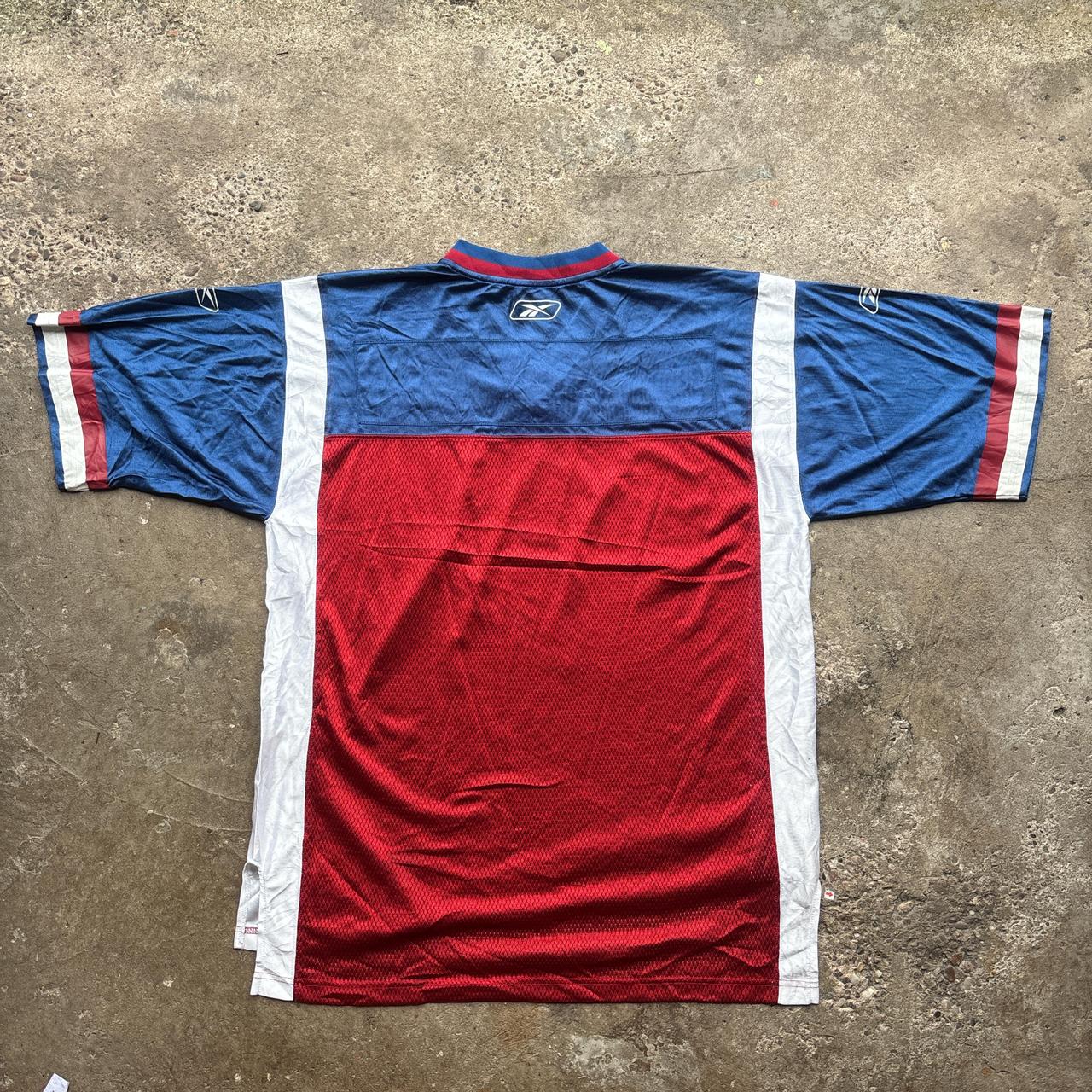 Red, blue and white Reebok CFL Alouettes jersey