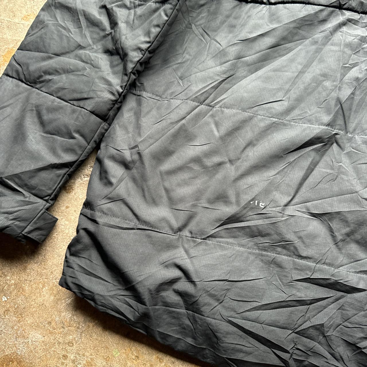 Black Nike puffer jacket with Transylvania Soccer embroidered logo