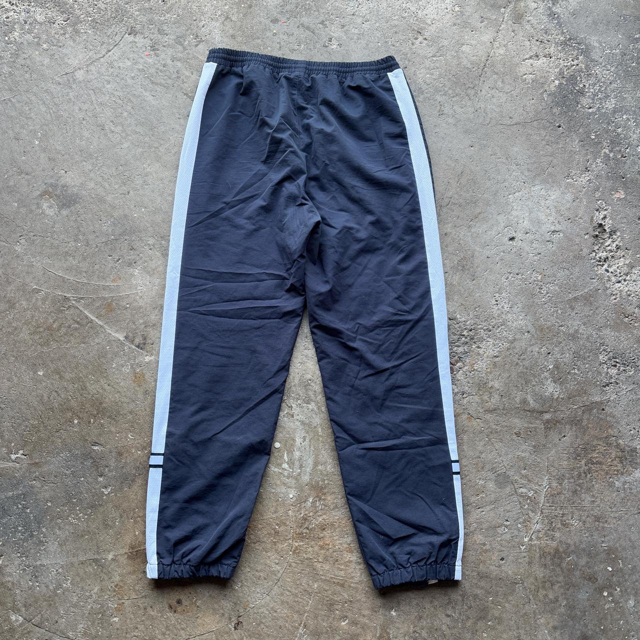 Vintage Navy Reebok tracksuit bottoms with embroidered logo