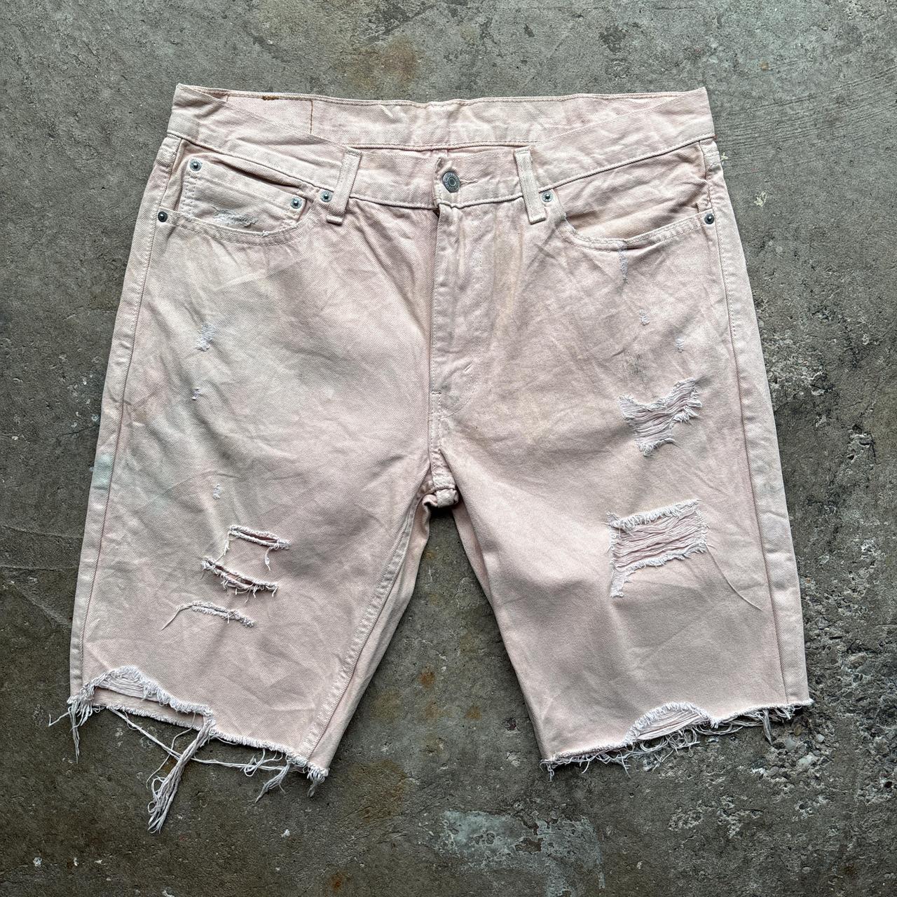 Pink Levi’s distressed shorts