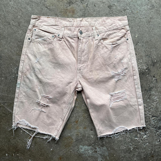 Pink Levi’s distressed shorts