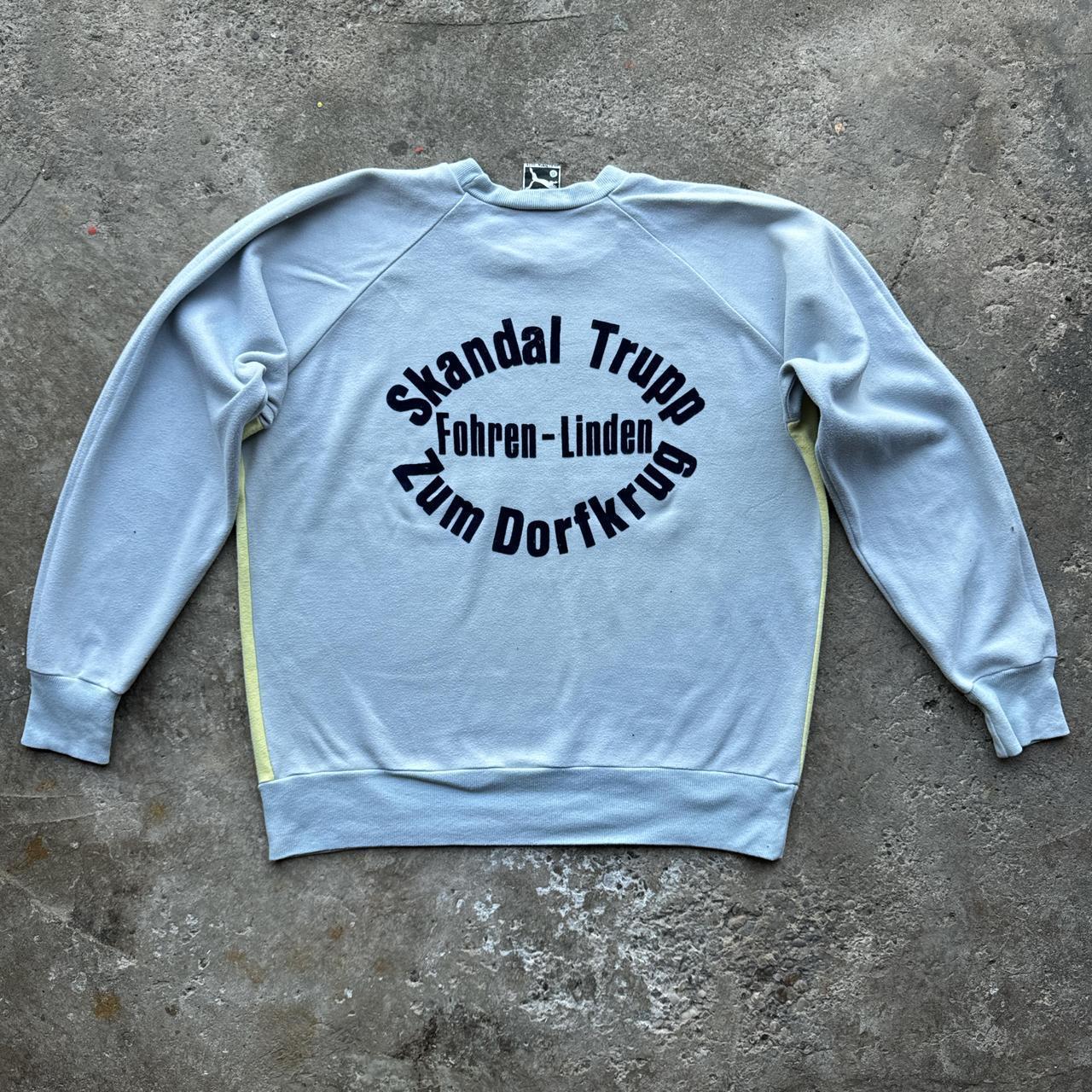 Grey and yellow Puma sweatshirt with German print at the back