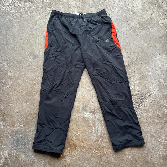 00s Black and orange Adidas track pants