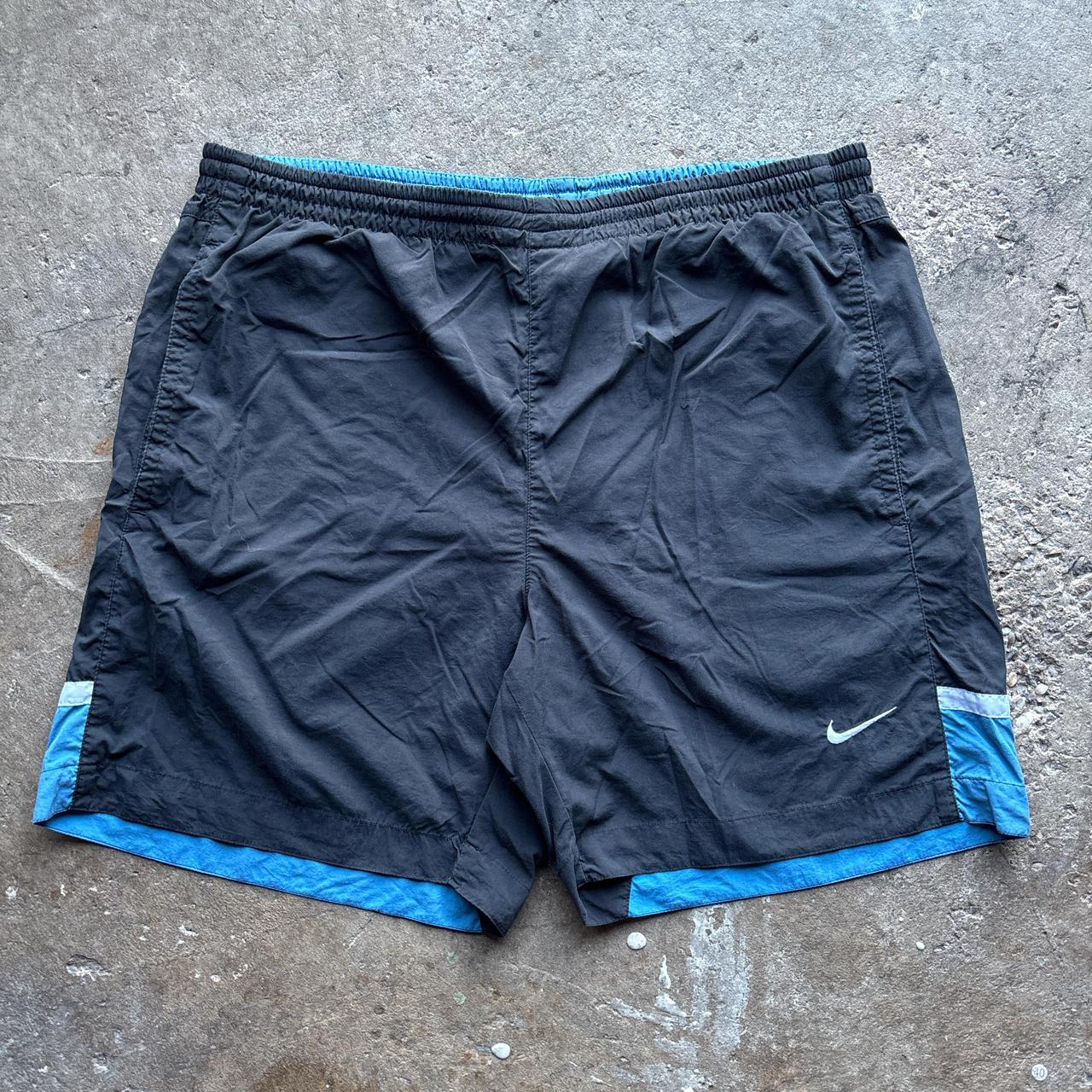 Black and blue Nike shorts / trunks