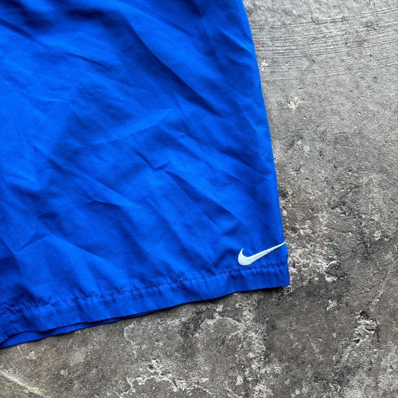 Blue Nike swim shorts / trunks
