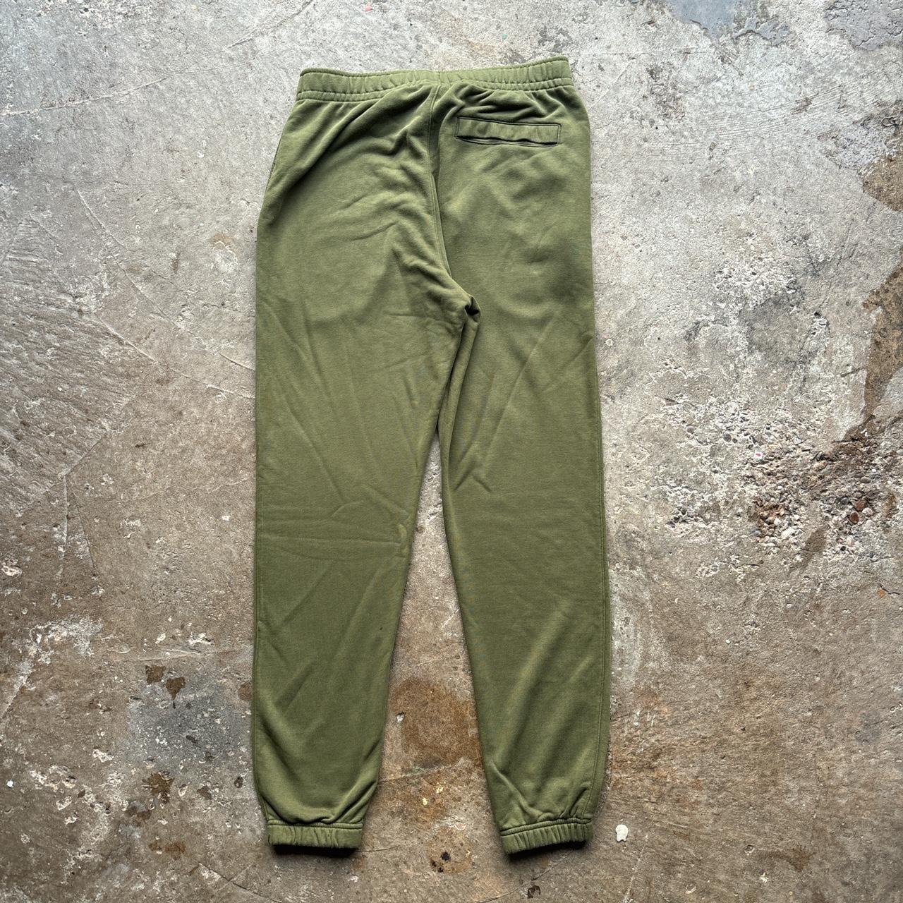 Nike green joggers with white embroidered logo