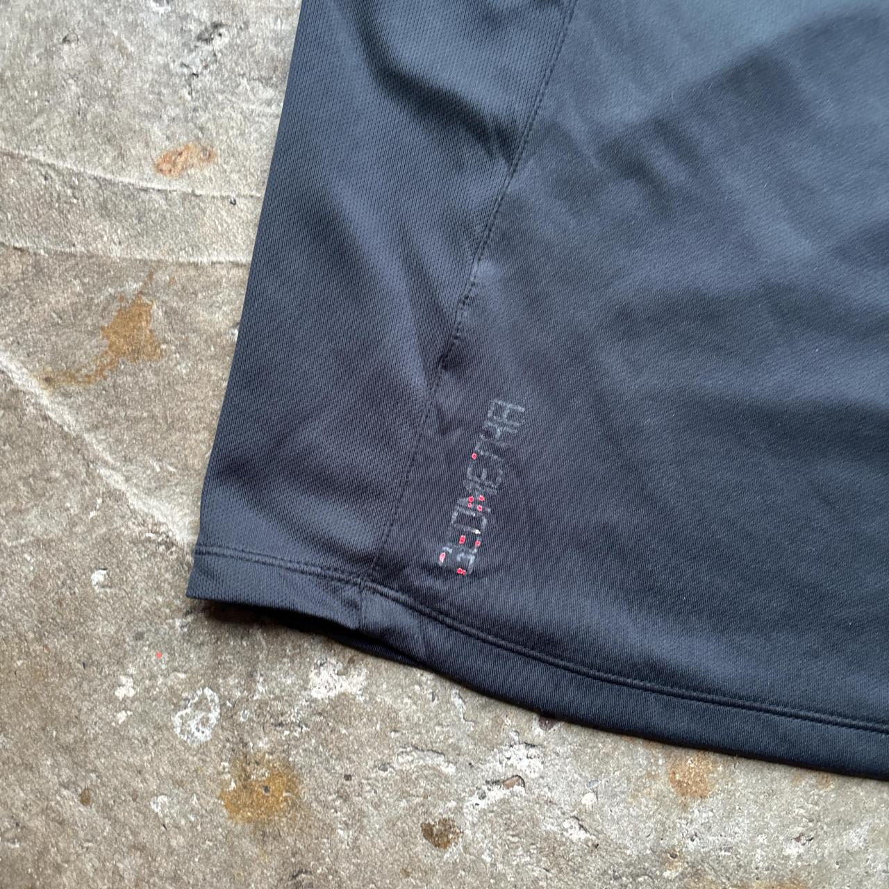Black Umbro activewear top with embroidered logo