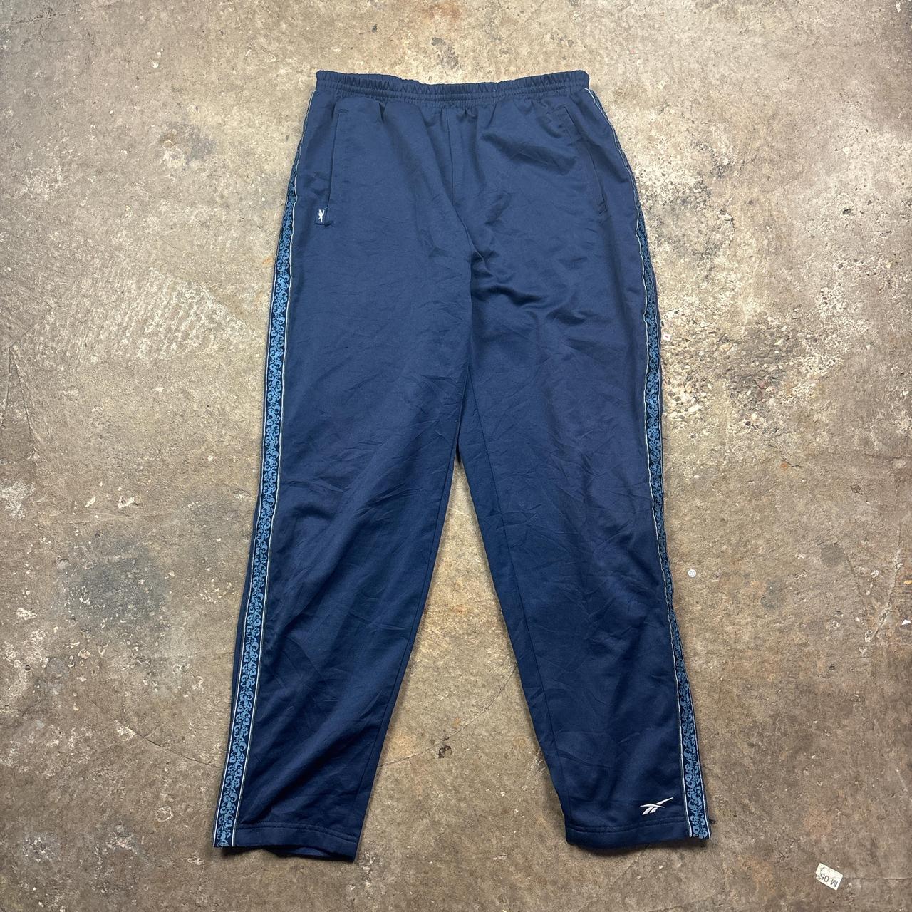 Vintage Blue Reebok track pants with embroidered logo and side stripe