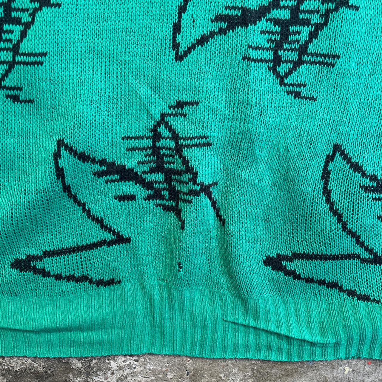 Green and black knitted sweater