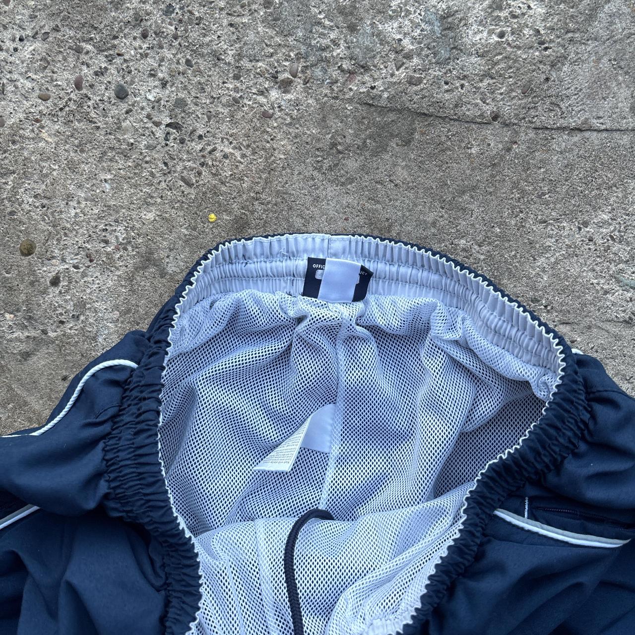 Navy Umbro joggers with white detailing