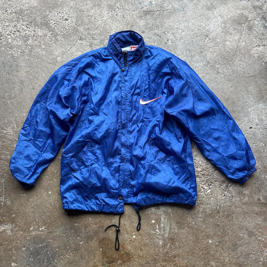 Blue Nike jacket with spell out logo
