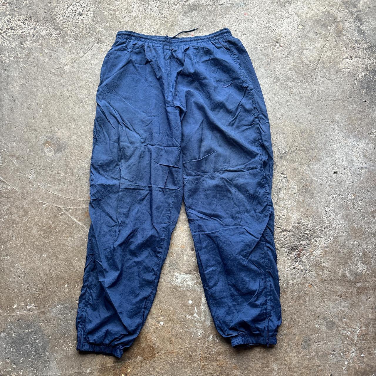 Navy Nike track pants with embroidered logo