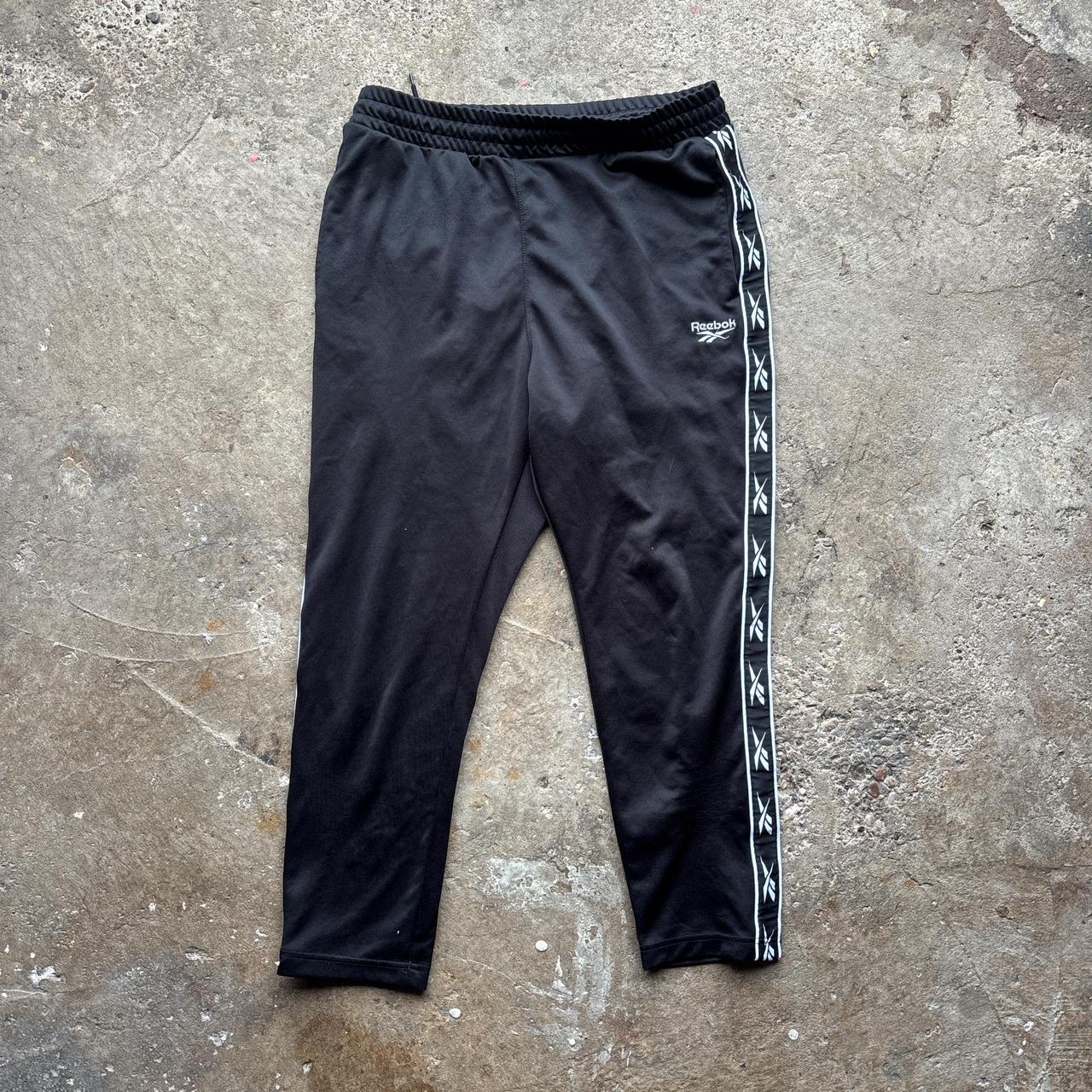Reebok black joggers with repeat logo stripe