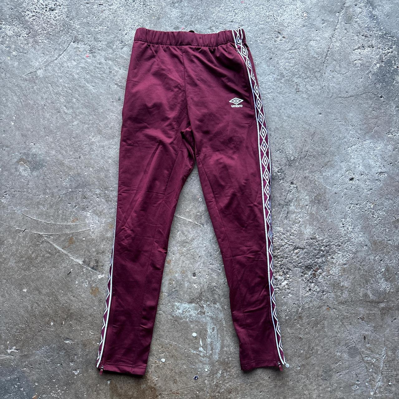 Burgundy Umbro sweatpants with stripe down the leg