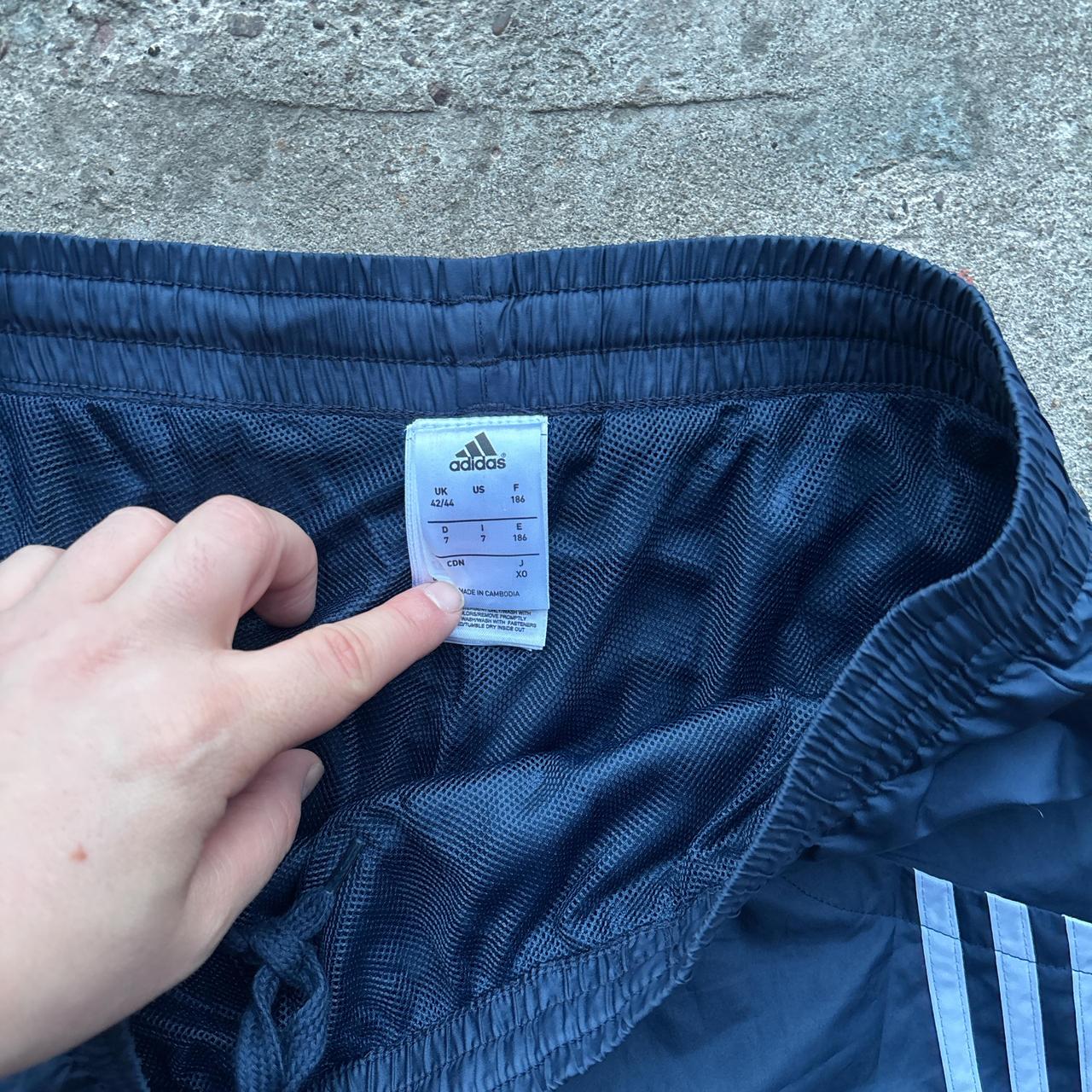 Navy blue Adidas track pants